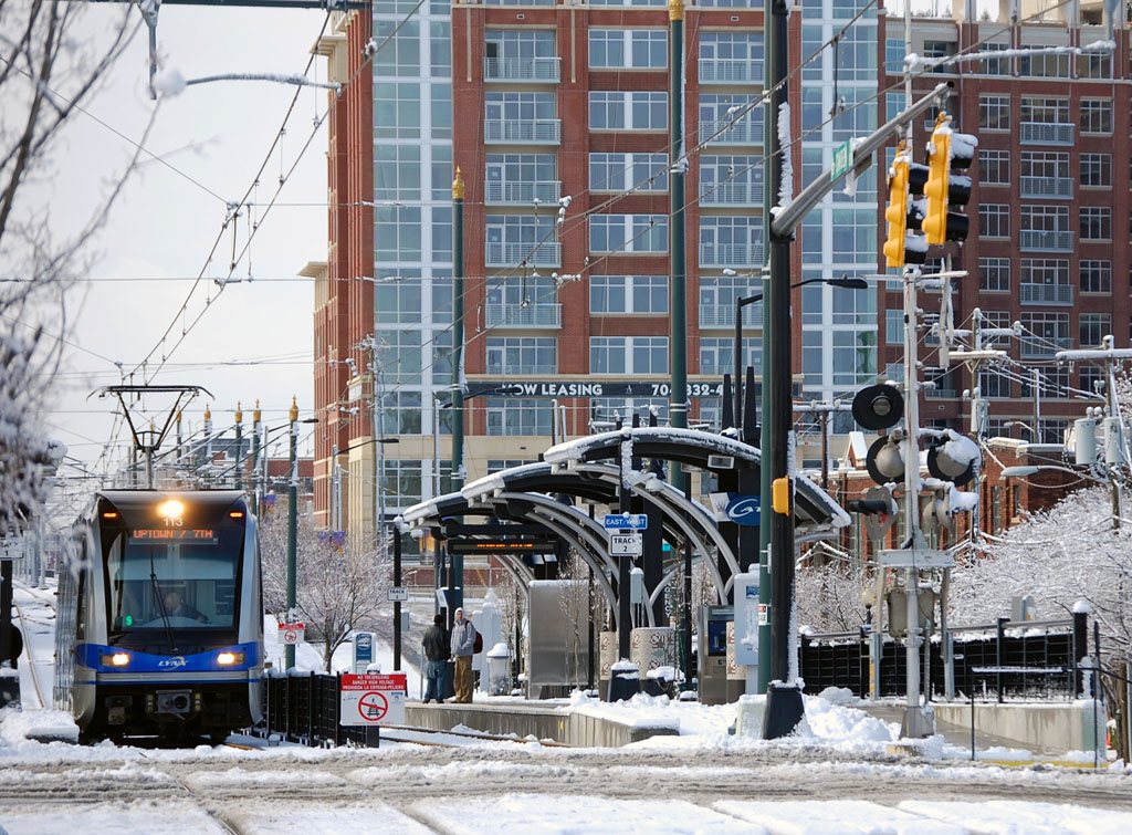 a LYNX Blue Line train arriving at a Charlotte light rail platform