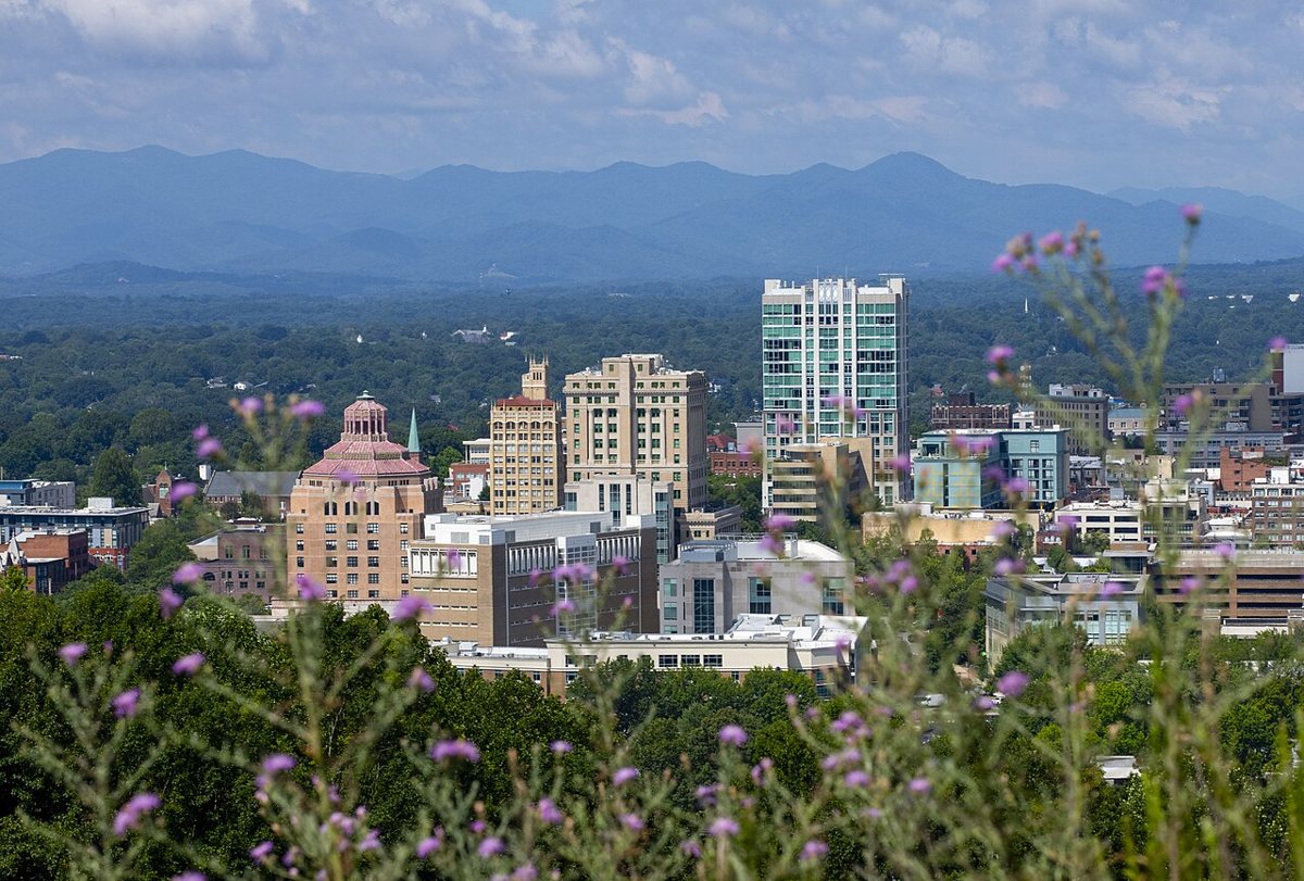 Downtown Asheville skyline with mountains in the background