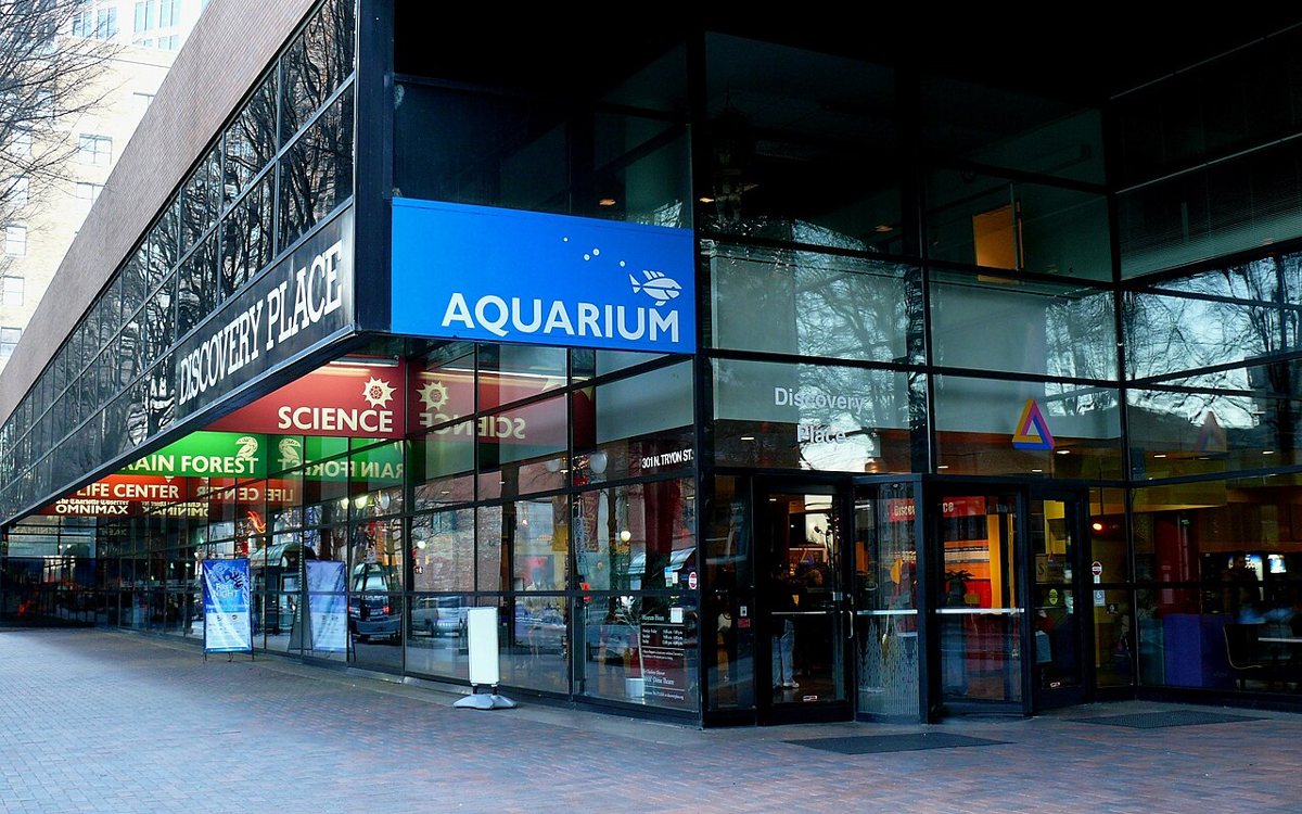 families exploring hands-on science exhibits at Discovery Place in uptown Charlotte