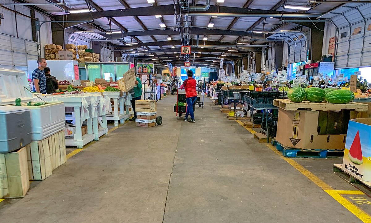 Produce stands and shoppers at the Charlotte Regional Farmers Market